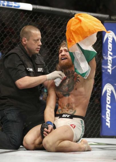 Conor McGregor, like Jesus, breaks down cries at the end of UFC 189. But why oh why? Credit - AP, John Locher 07-11-15